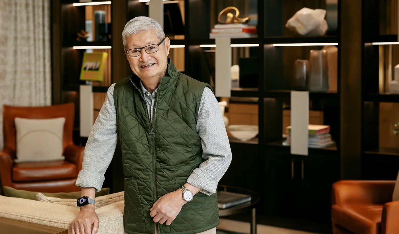 Coterie resident William Lee standing in community common space smiling.