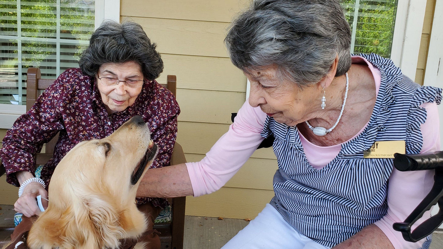 Atria residents photographed with their furry companions
