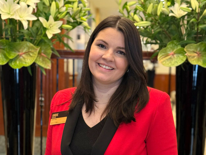 Andie Bazelais Executive Director at Atria West 86, photographed at the community wearing a red blazer