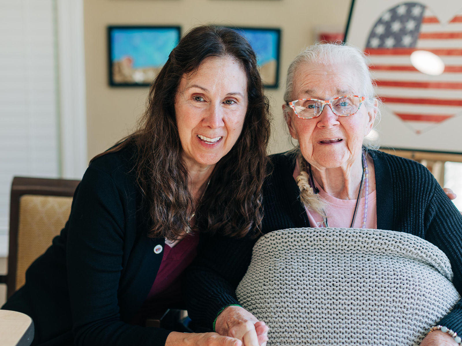 senior women sitting with her daughter