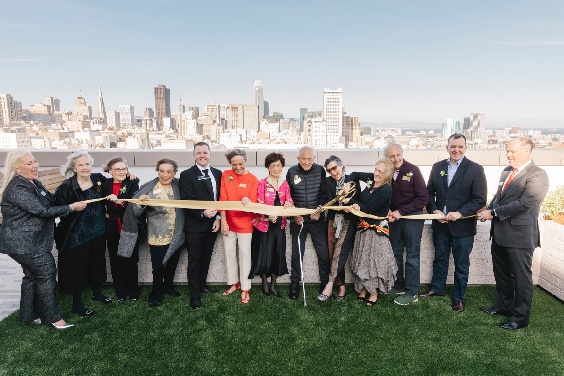 Ribbon Cutting at opening of Coterie Cathedral Hill with department heads and first residents.