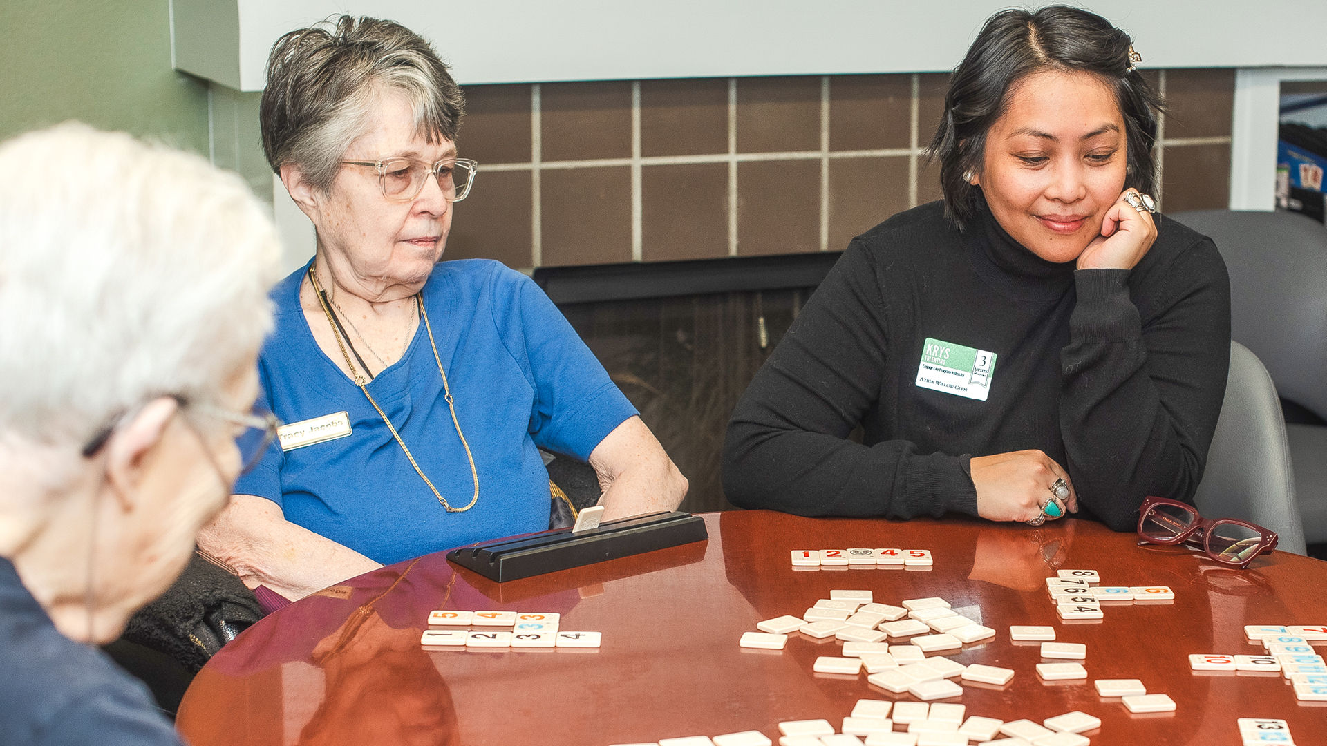 Krys and Atria residents playing dominoes