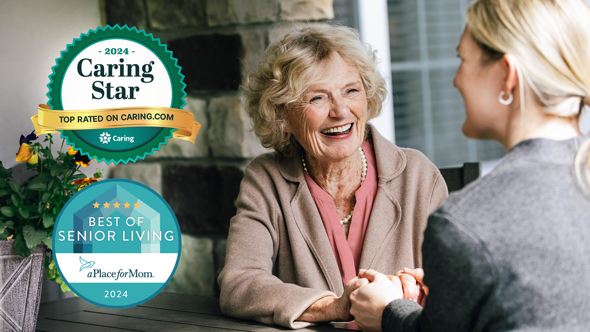 Photo of senior resident and community manager holding hands and laughing with the 2024 Caring Star badge and 2024 Best of Senior Living Badge on the left.