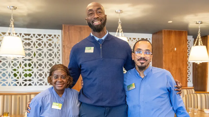 Atria Center City Community Sales Director Marcel, photographed with other Atria team members