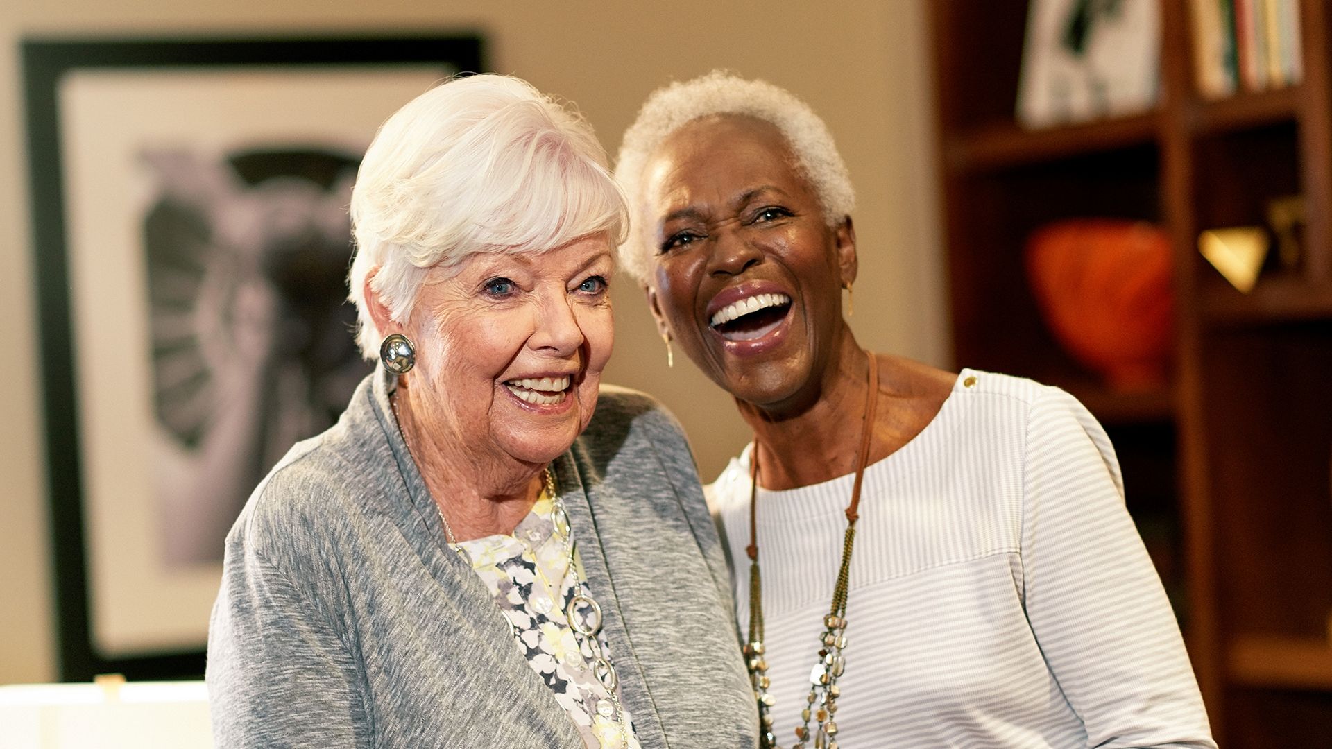 Two older women laughing together