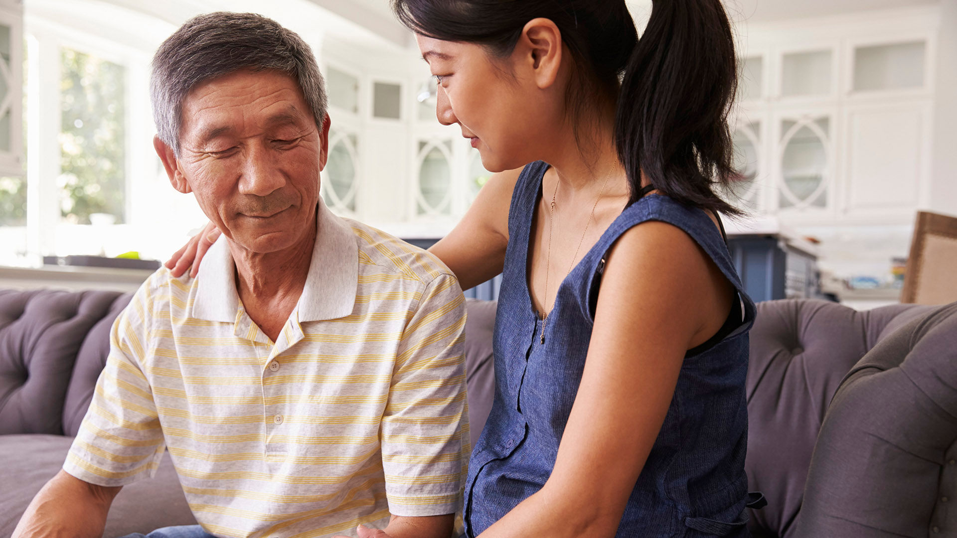 Adult Daughter Talking To Father At Home
