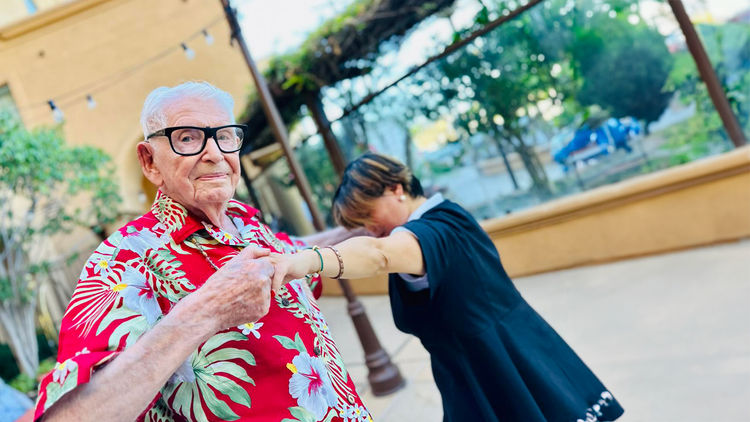 Senior man dancing with woman