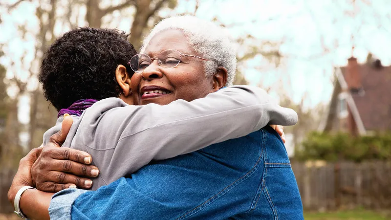 Senior hugging her daughter