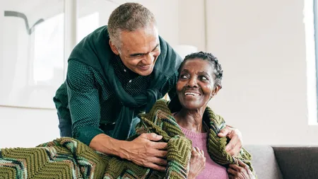 Son visiting mother in retirement home