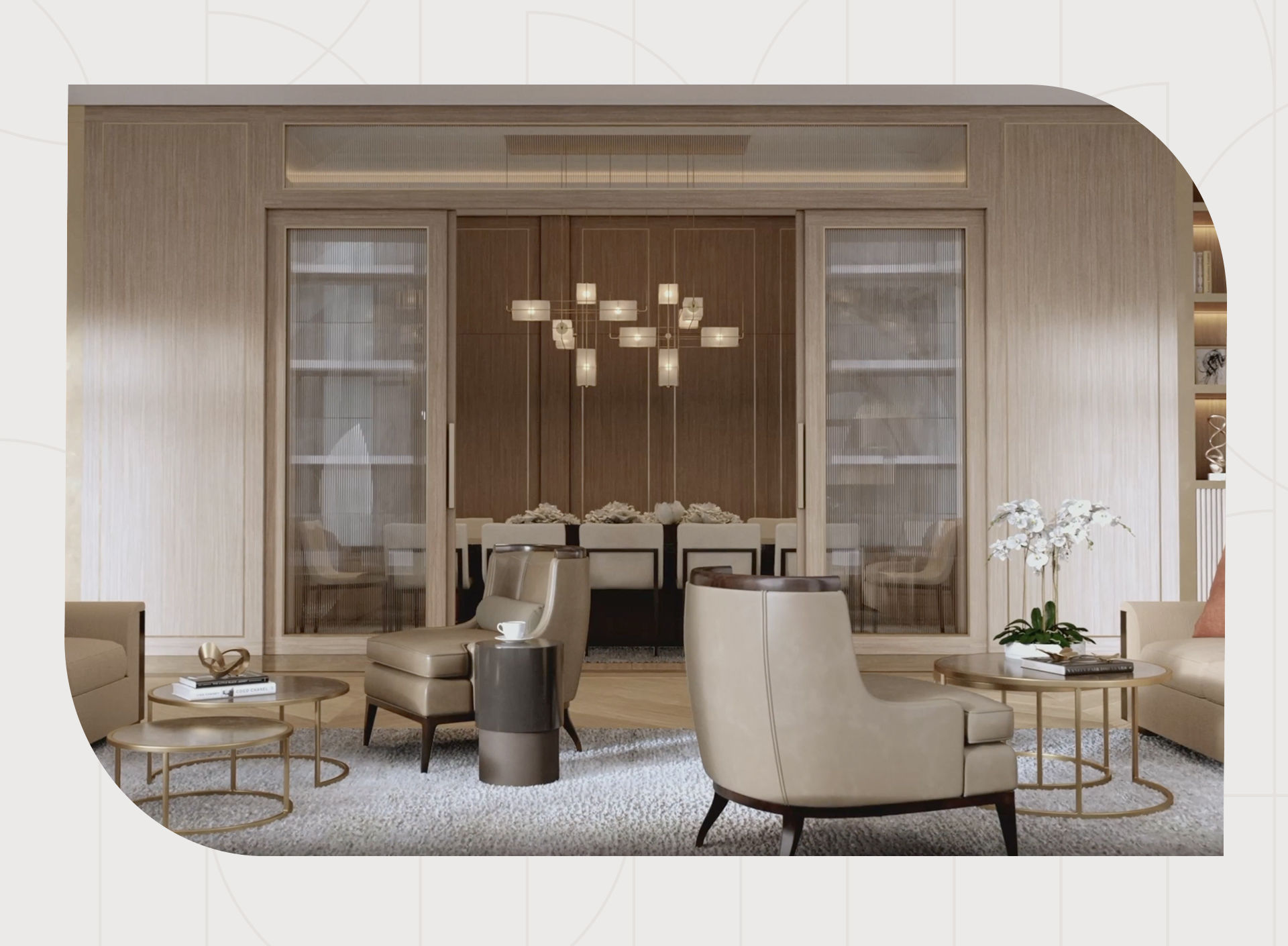 Elegant living room with beige armchairs, a modern chandelier, glass doors, and a dining area in the background. Neutral tones and sleek design.