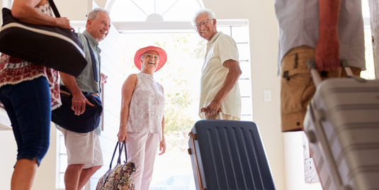 senior friend group preparing for a luxury trip