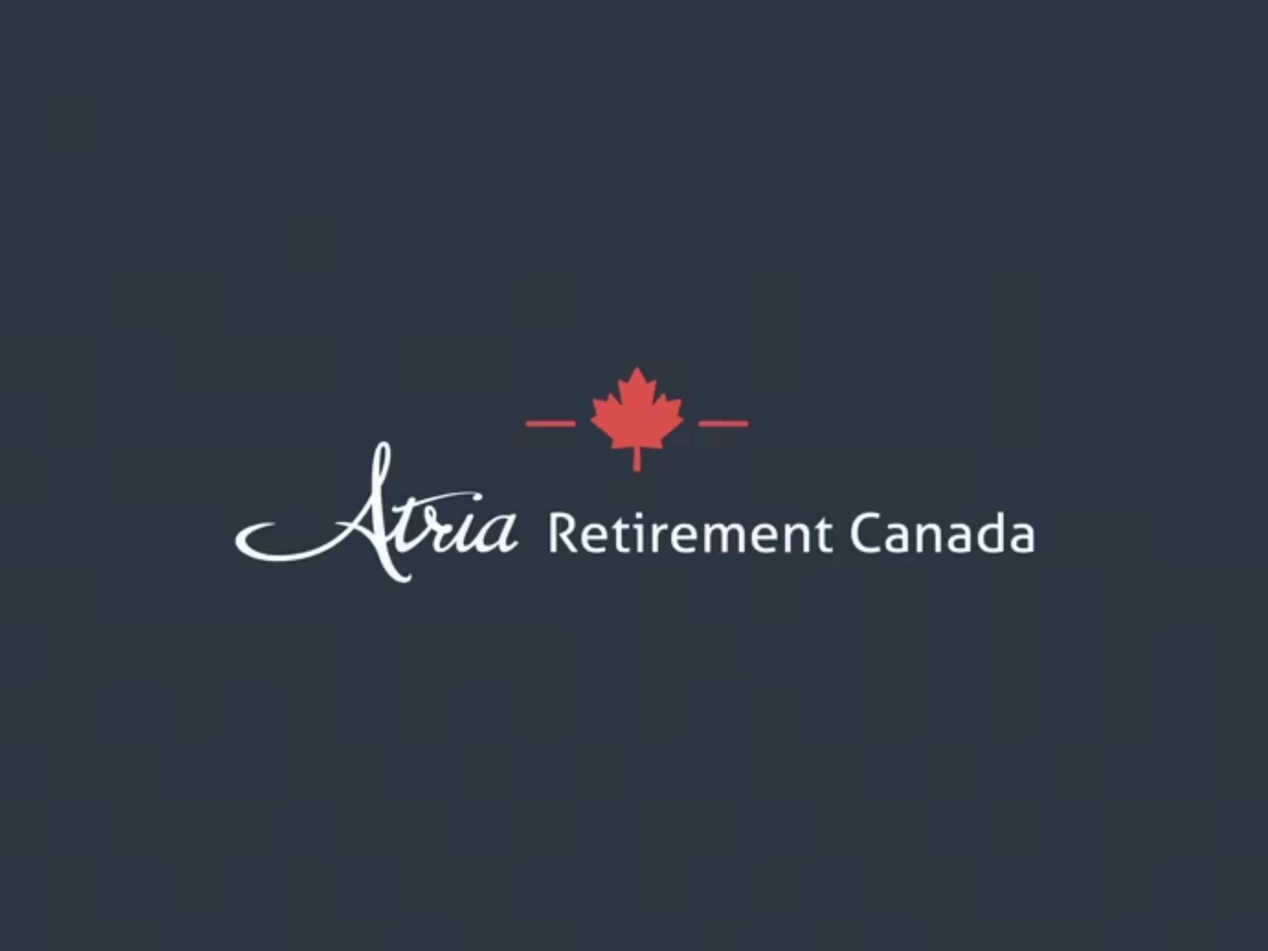 Logo of Atria Retirement Canada with a red maple leaf icon on a dark blue background.
