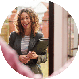 Saleswoman at the step of a senior's door