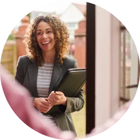 Saleswoman at the step of a senior's door