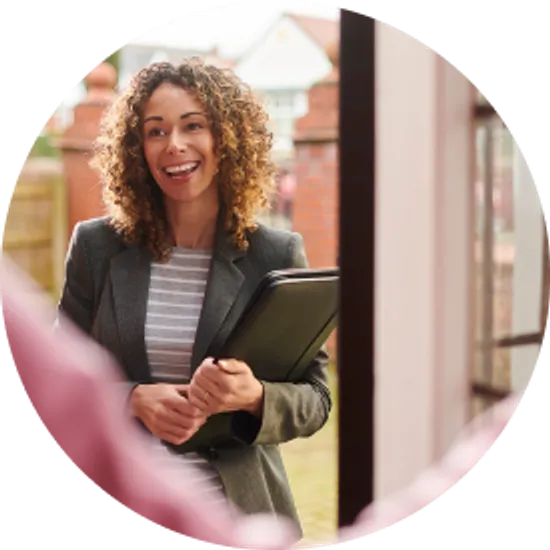 Saleswoman at the step of a senior's door