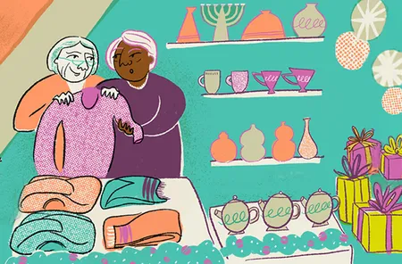 Two women browsing sweaters in a festive shop with colorful gifts, ceramics, and holiday decorations on shelves.