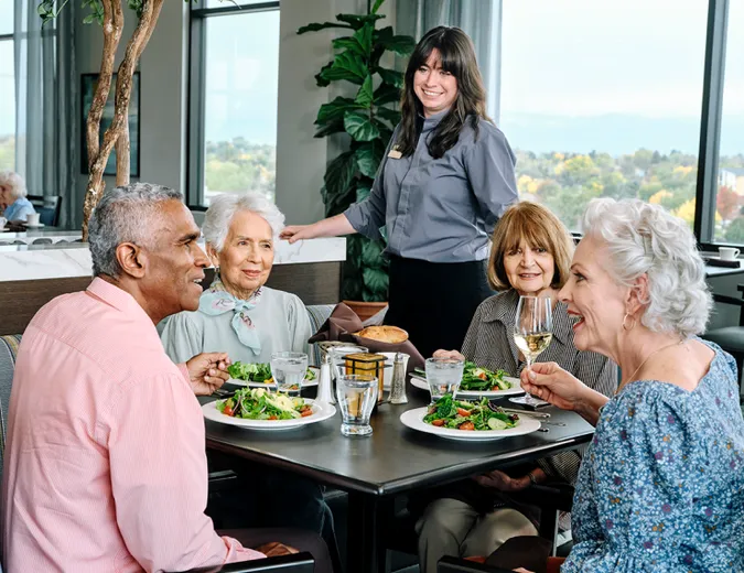 Atria Senior Living residents enjoying a meal together