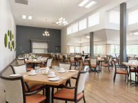 Dining room with tables, chairs and large windows with lots of light., click to stop animation