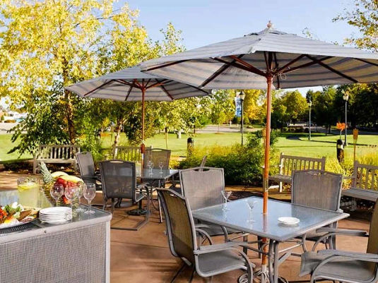 Atria Marina Place shaded patio dining in the courtyard
