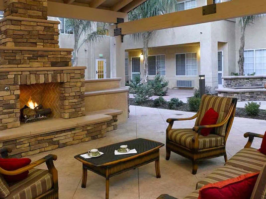 Atria Las Posas fireside seating in the courtyard