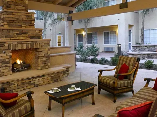 Atria Las Posas fireside seating in the courtyard