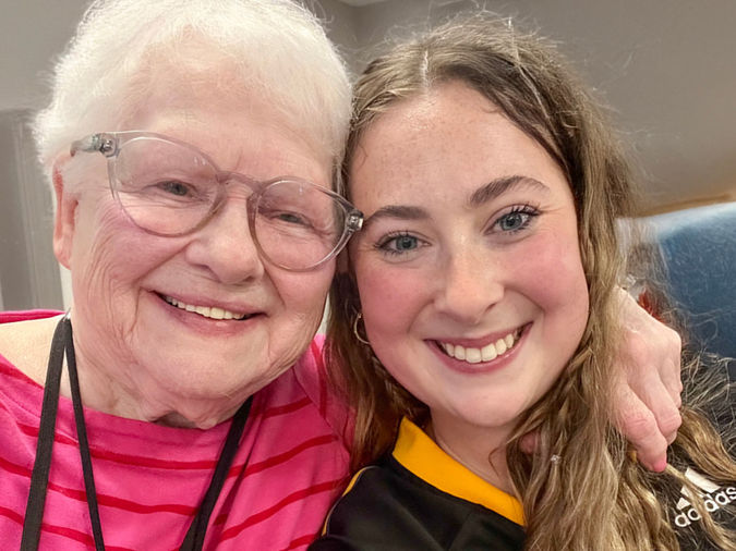 Sarah Alexi, the Engage Life Coordinator at Holiday Crescent Heights photographed with female resident