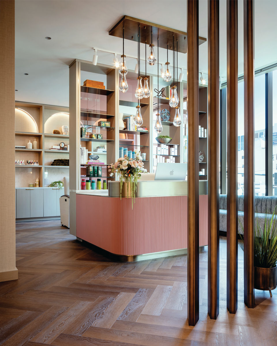 Cathderal Hill salon, luxirious reception counter with pendant lights.