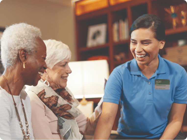 Two Atria Residents enjoying time with an Atria employee