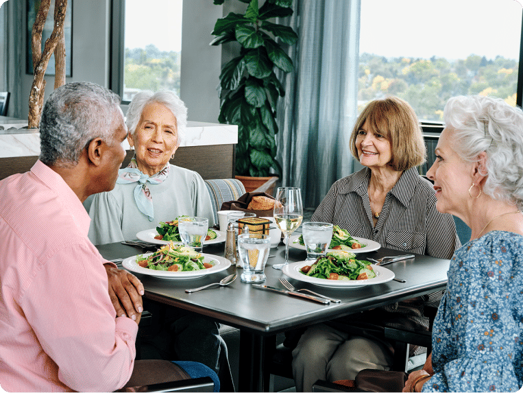 Atria Senior Living residents enjoying a meal together