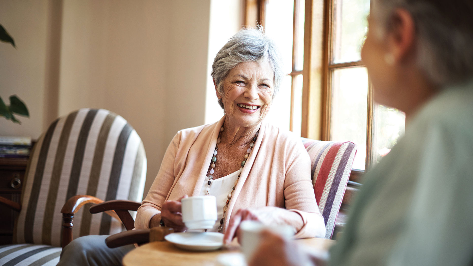Shot of two senior women having tea together