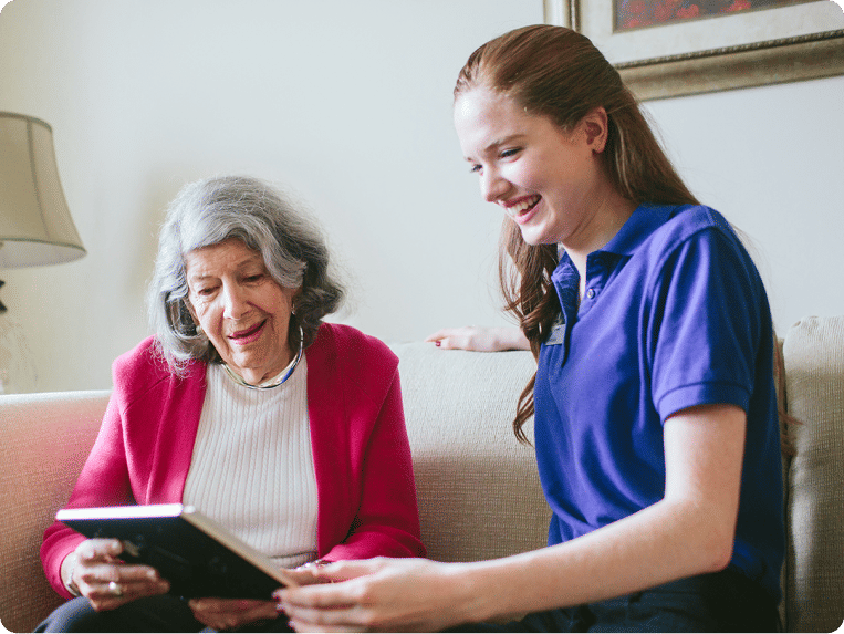 Two women looking at photo album