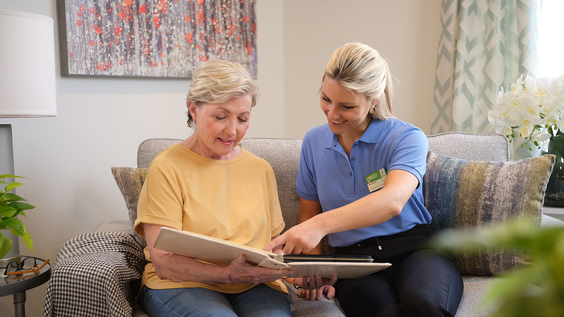 Atria residents looking at photos together