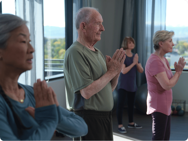 Four seniors doing yoga together