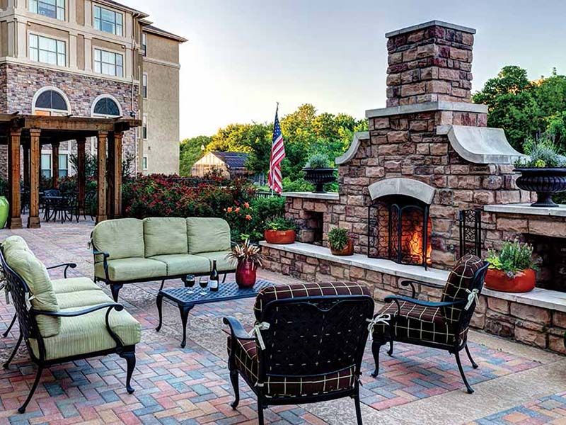 Outdoor fireplace and patio at Atria Canyon Creek