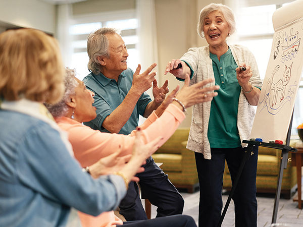 Image of Atria Senior Living residents playing a game together