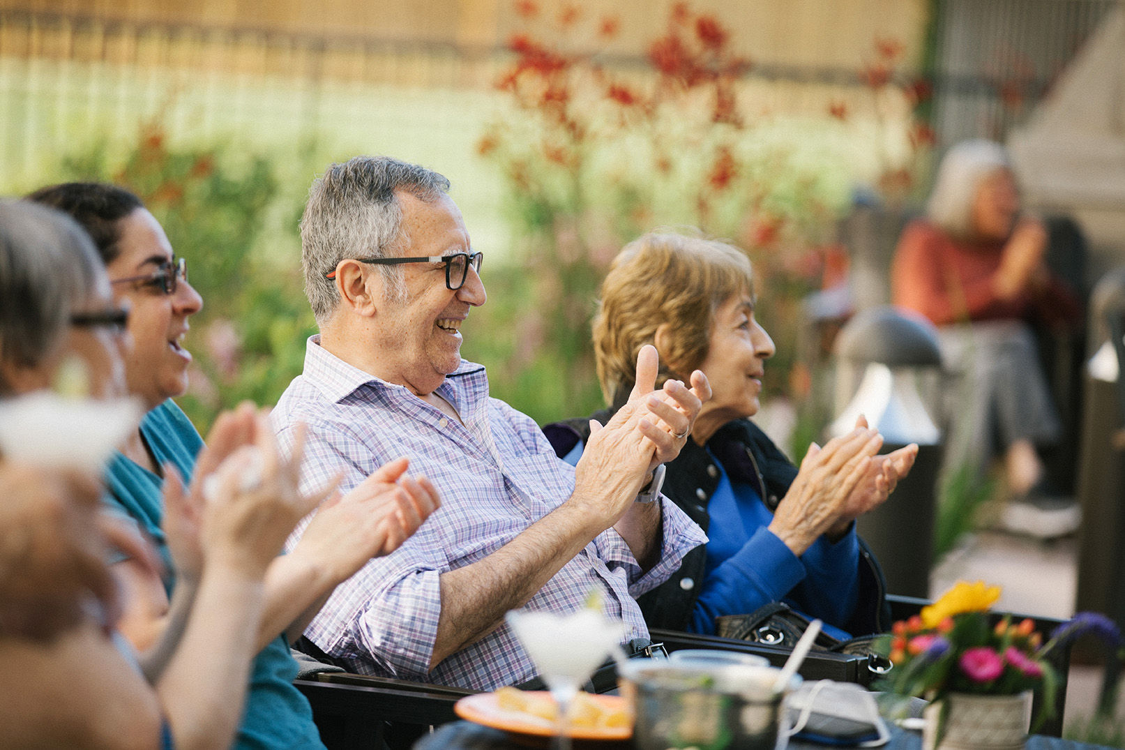 Senior Living residents enjoying time together outside on the patio