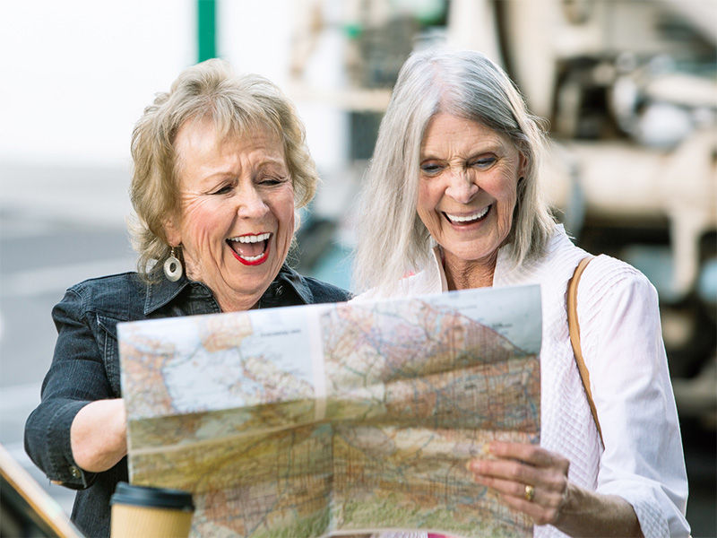 Two woman looking at a road map