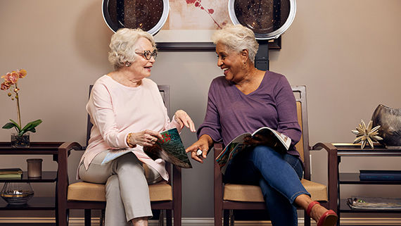 two residents in salon talking