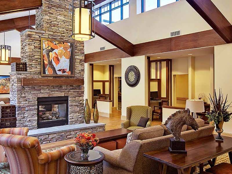 Cozy fireplace and living room at Atria on the Hudson senior living community