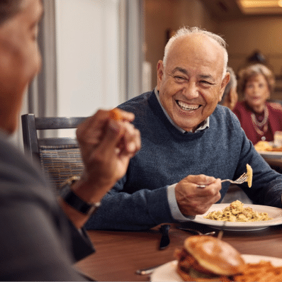 Senior man having dinner with friends