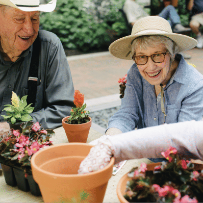 Senior residents potting flowers