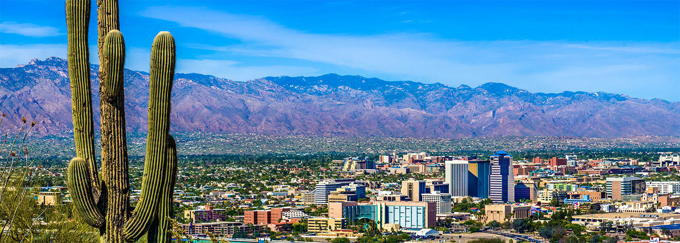 Tucson, AZ city skyline with mountains in the background