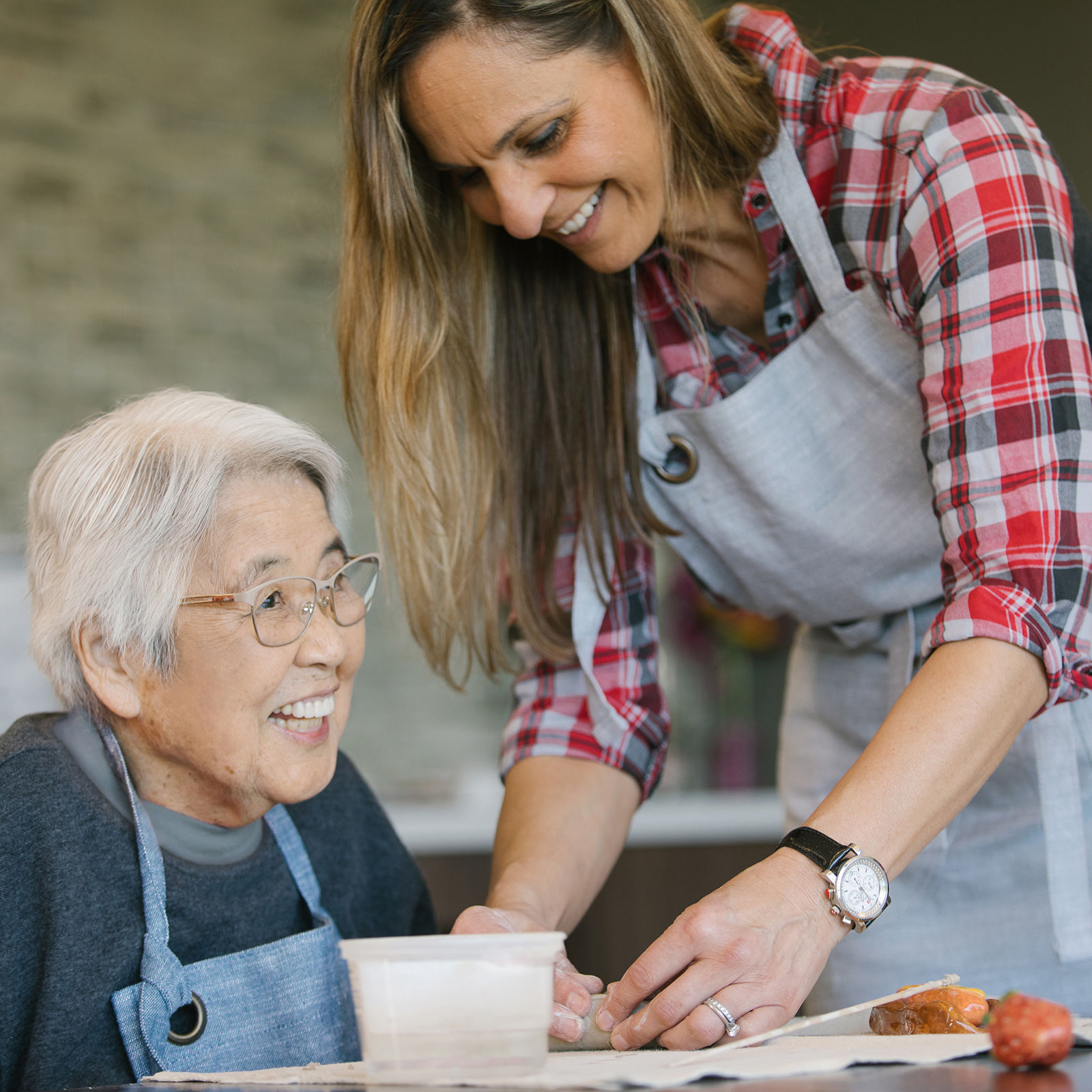 Senior resident and daughter making art