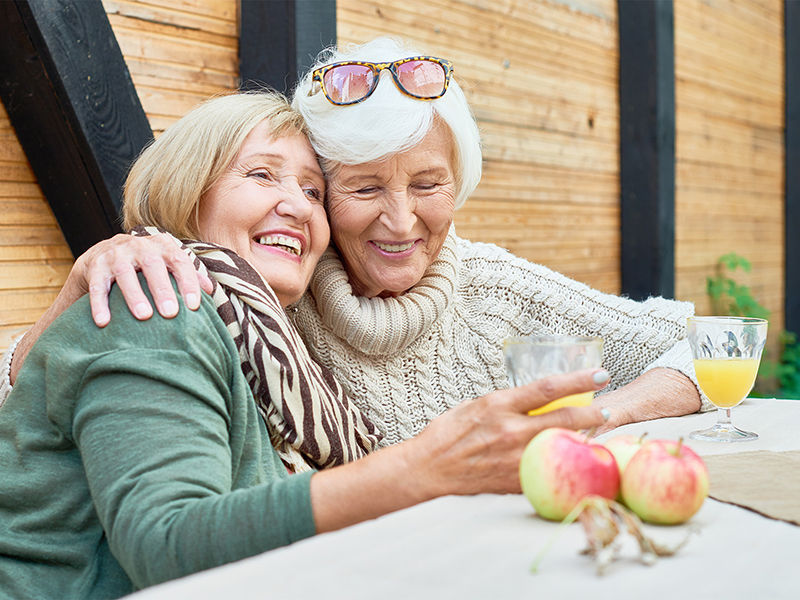 Two women hugging and smiling