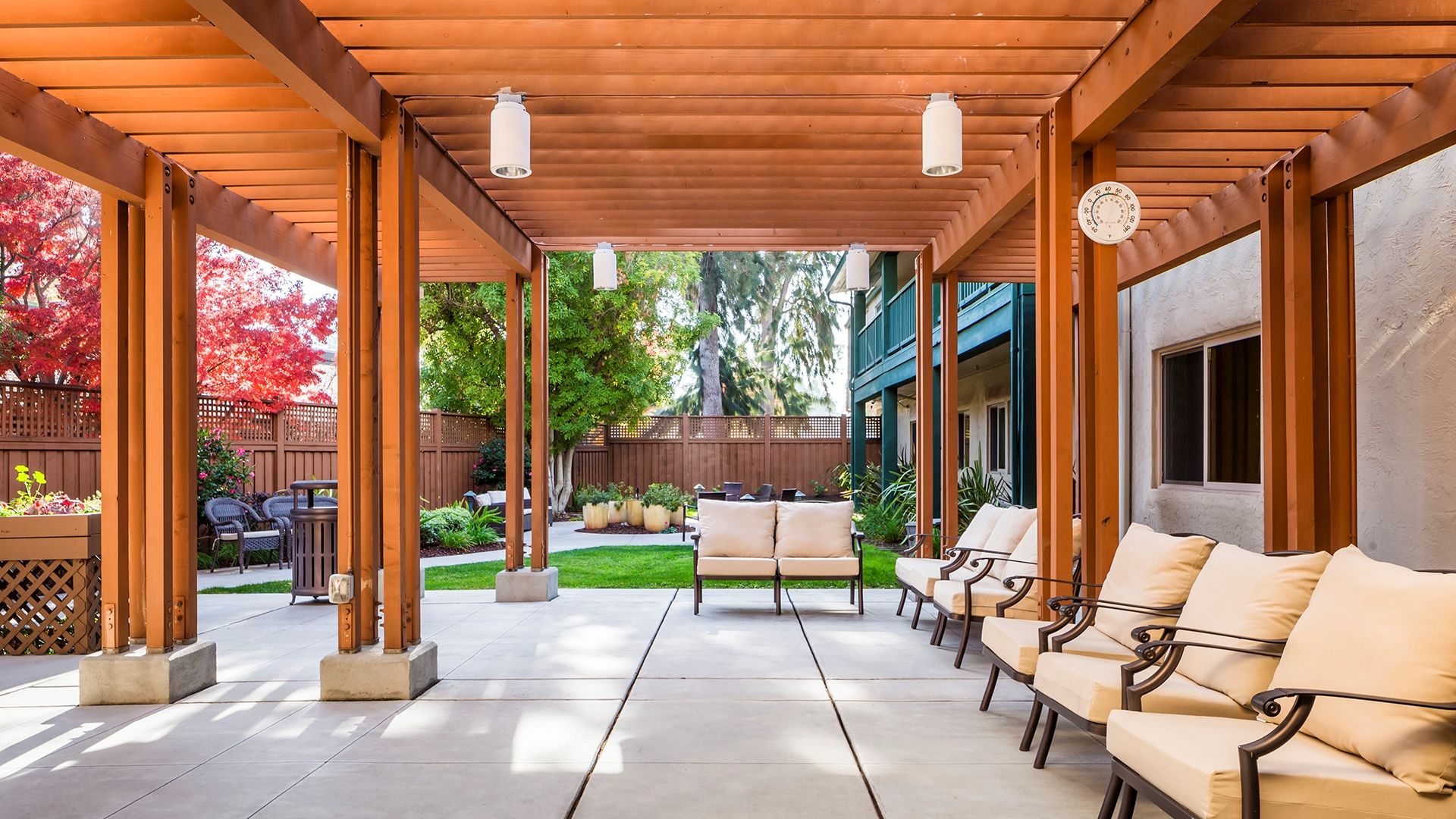 Outdoor Patio image of Atria Sunnyvale with pergola and outdoor seating