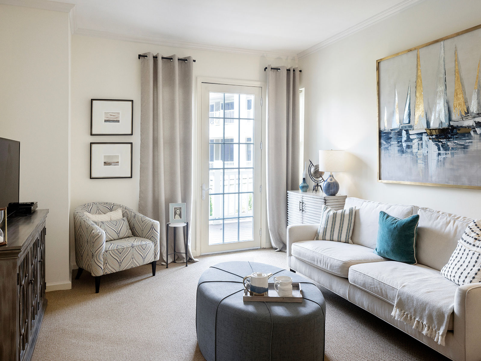 Modern senior living apartment at Atria on Roslyn Harbor, featuring a painting of sailboats