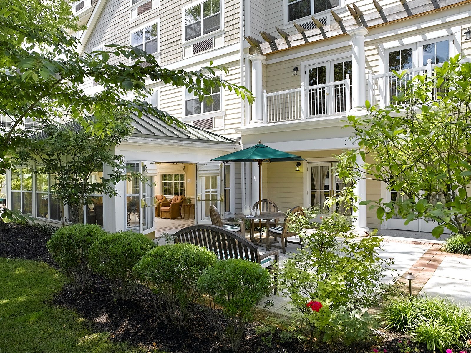 Outdoor back patio and sun room at Atria Tanglewood