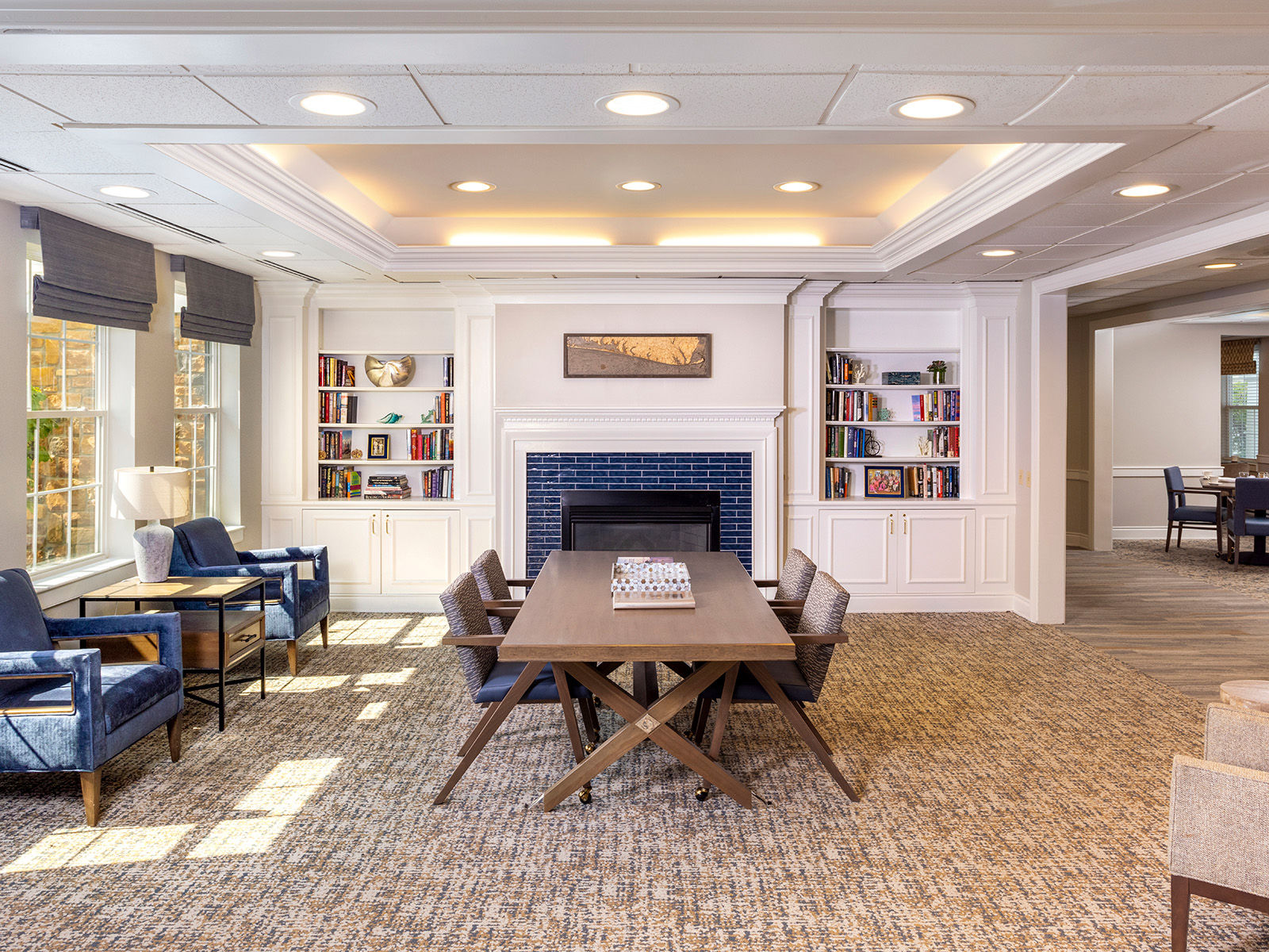 Atria Tinton Falls modern community living room with fireside seating