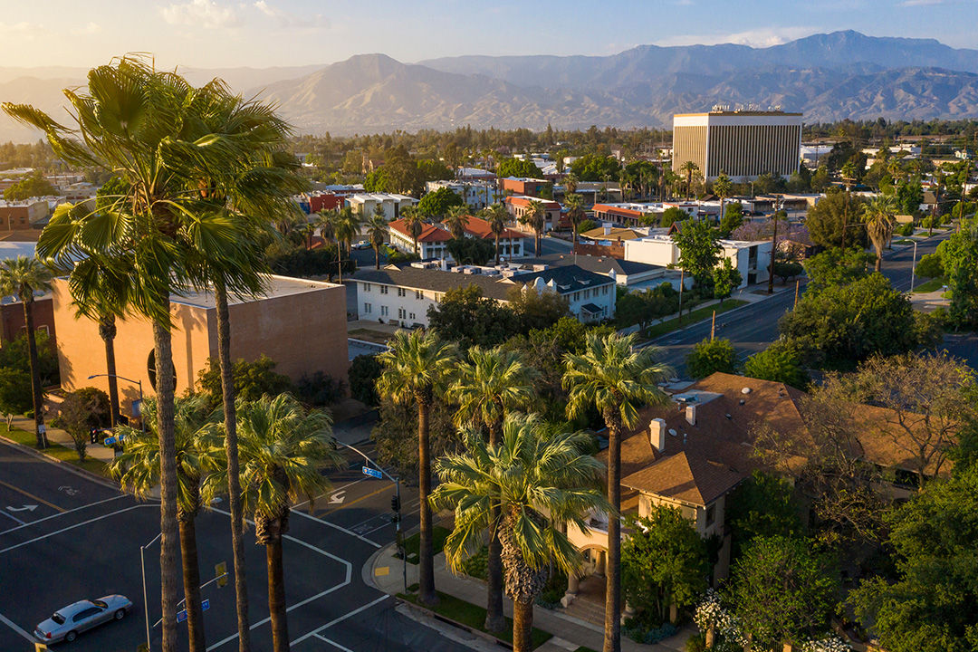 Sunset view of the Inland Empire surrounded by mountains in Southern California.