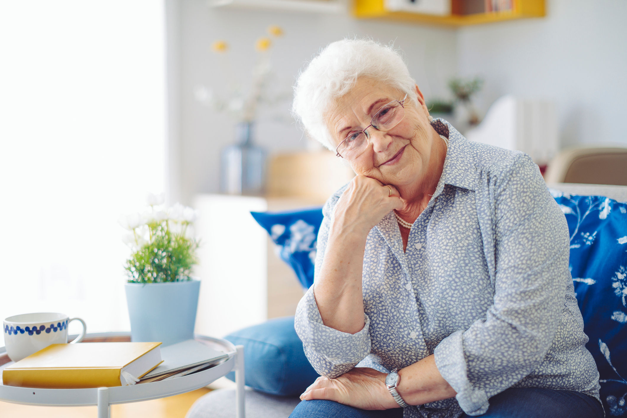Senior woman smiling on the couch